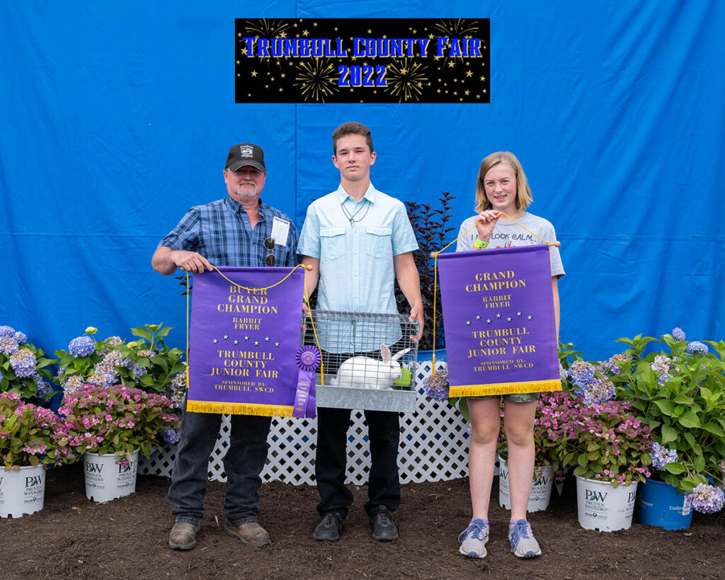 Noah Morris sold the grand champion rabbit to Larry and Yevonne Postlethwait.
