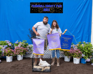 Grace Stout sold the reserve champion chickens to Roman Supply Co.