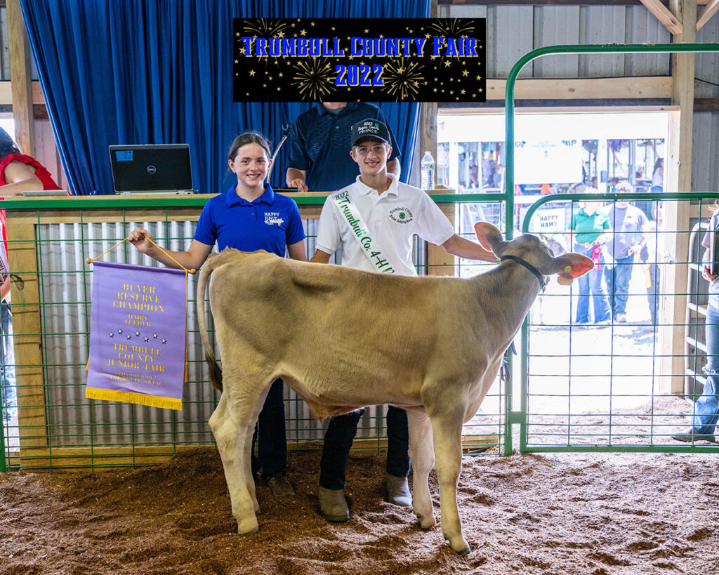 Carter Kibler sold the reserve champion dairy beef feeder to Dr. Ted and Lisa Ramsey for $3.20 per pound.