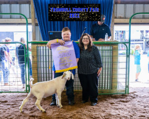 Evan Shoenberger sold the reserve champion goat to Martha Yoder West for $13 per pound.